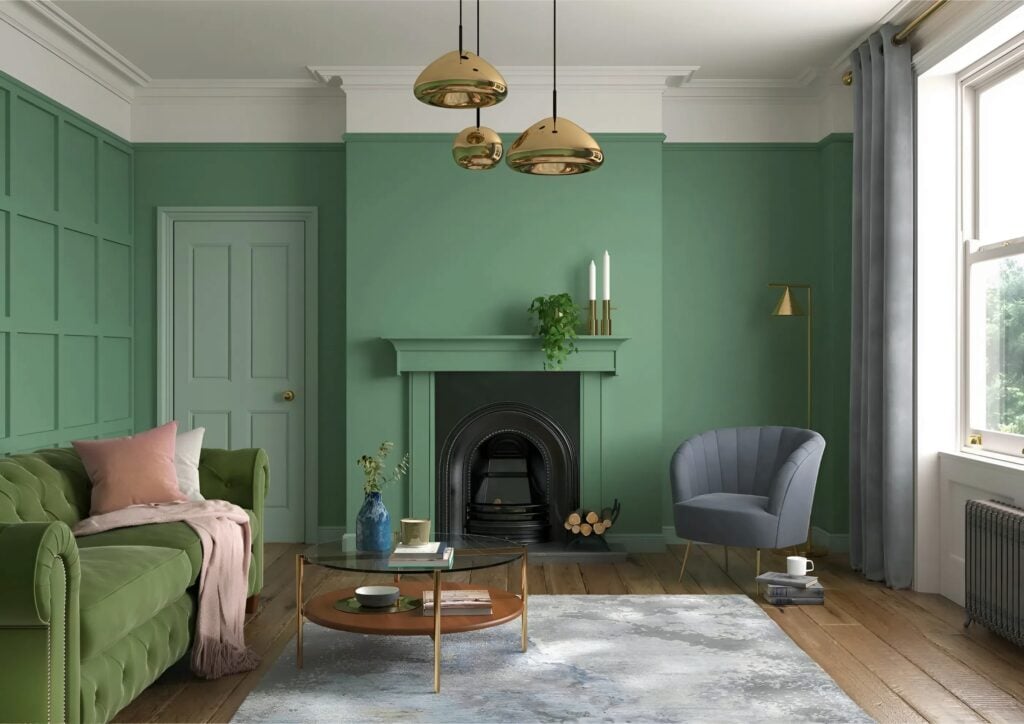 Deep green interior walls with matching trim and fireplace by a house painter in Baltimore, MD