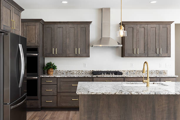 Dark gray painted kitchen cabinets with a smooth matte finish, and gray granite countertops by a house painter in Howard County, MD.